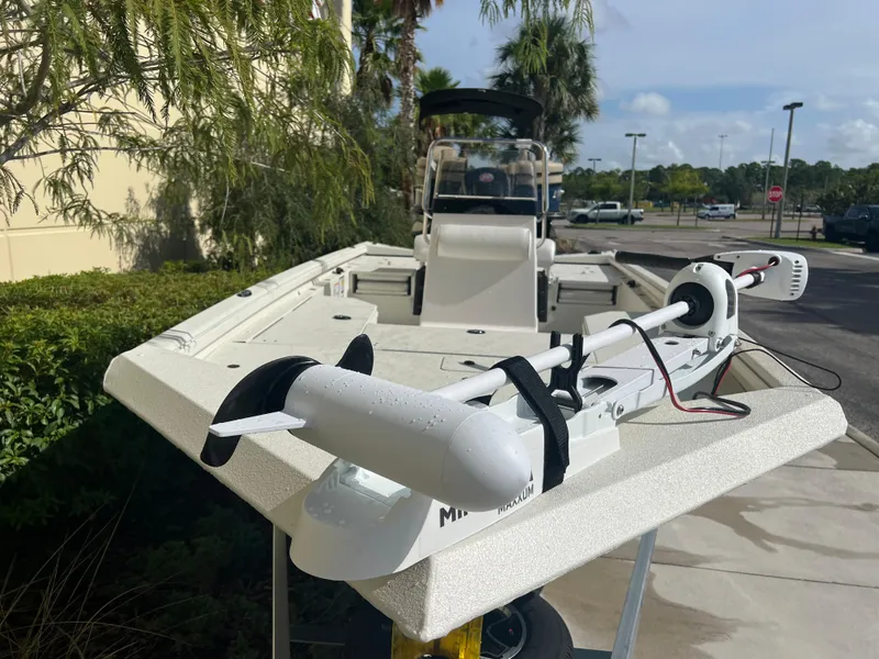 Slide: The Image of 2024 Ranger RB190 boat with trolling motor, parked outdoors. - 2