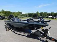 Slide: The Image of 2024 Ranger RT188 fishing boat on a trailer in a parking lot. - 11