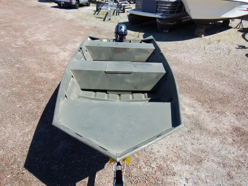 Slide: The Image of 2018 Polar Kraft Jon 1448 LW aluminum fishing boat on gravel lot. - 10