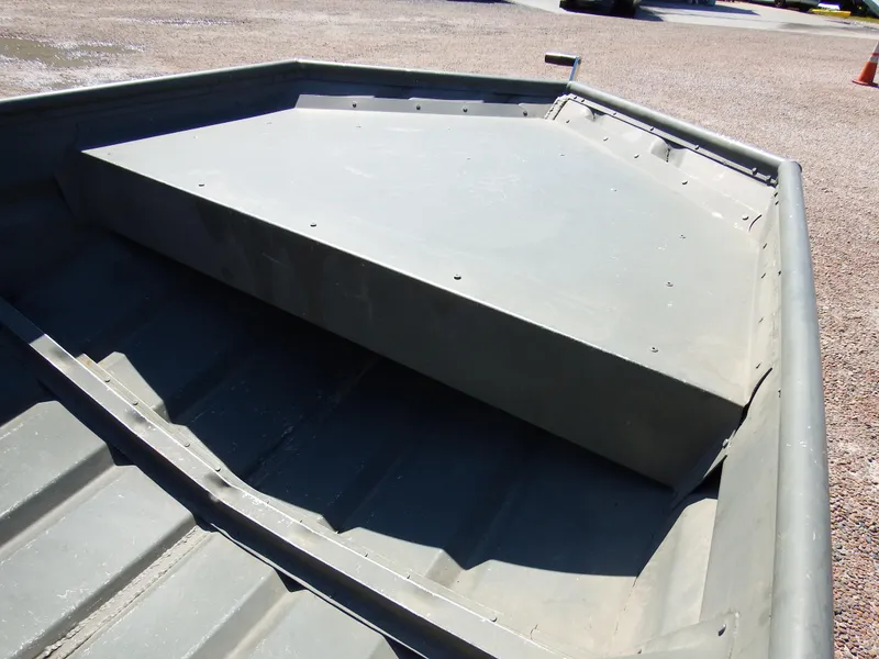 Slide: The Image of 2018 Polar Kraft Jon 1448 LW aluminum boat interior, showing bow storage compartment. - 11