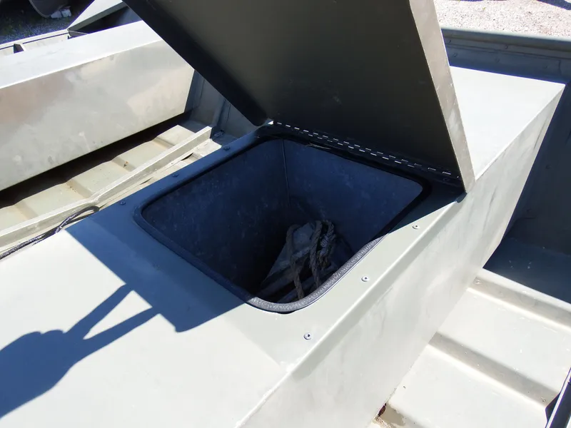 Slide: The Image of 2018 Polar Kraft Jon 1448 LW storage compartment with open lid. - 13