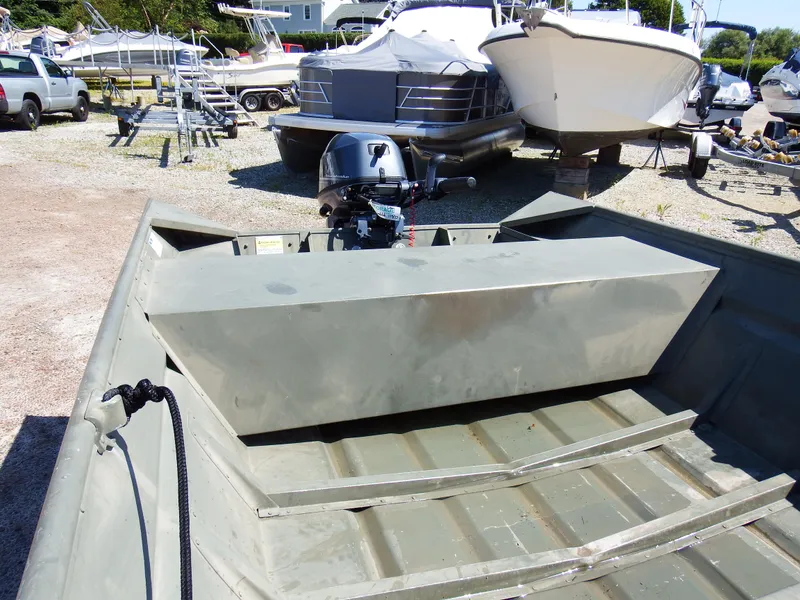 Slide: The Image of 2018 Polar Kraft Jon 1448 LW boat with outboard motor in a boatyard. - 14