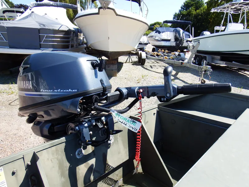 Slide: The Image of 2018 Polar Kraft Jon 1448 LW boat with Yamaha outboard motor in a boatyard. - 15