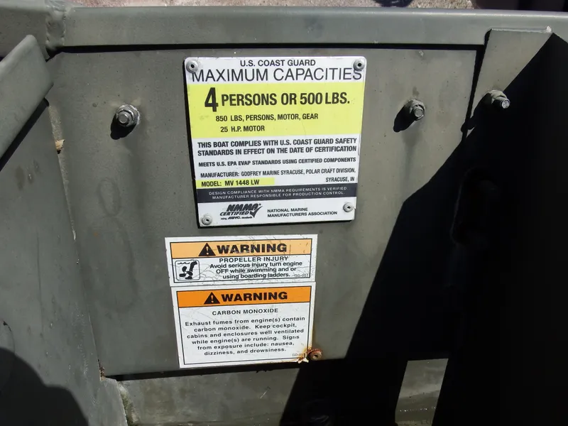 Slide: The Image of 2018 Polar Kraft Jon 1448 LW boat capacity and safety warning labels. - 16