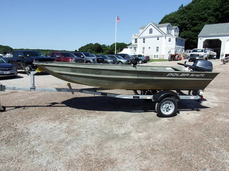 Slide: The Image of 2018 Polar Kraft Jon 1448 LW boat on trailer in parking lot. - 2