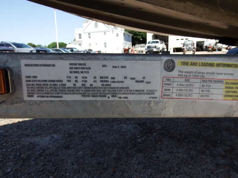 Slide: The Image of Tire and loading information label on a 2018 Polar Kraft Jon 1448 LW boat trailer. - 22