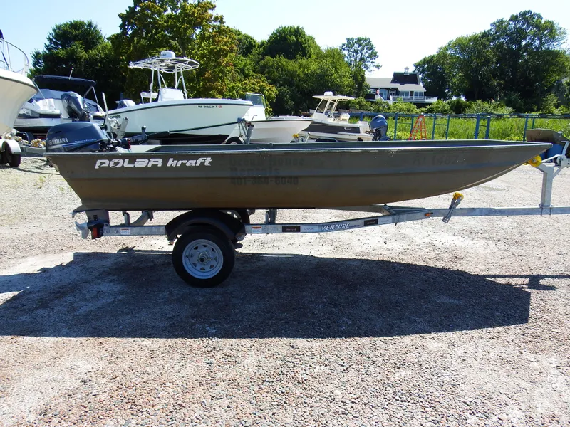 Slide: The Image of 2018 Polar Kraft Jon 1448 LW boat on trailer in outdoor setting. - 7
