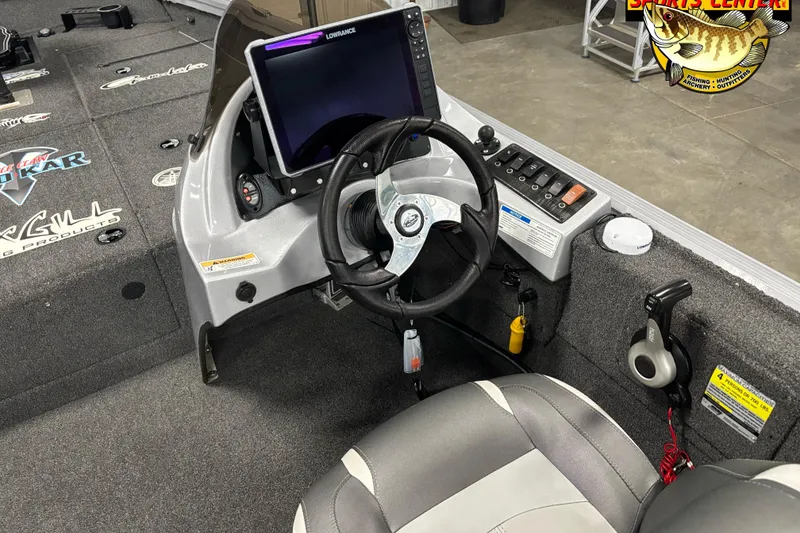 Slide: The Image of 2018 Polar Kraft TX 195 boat interior with steering wheel and control panel. - 6