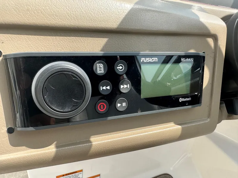 Slide: The Image of Fusion MS-RA70 Bluetooth stereo system on a 2015 Regal 1900 boat dashboard. - 12