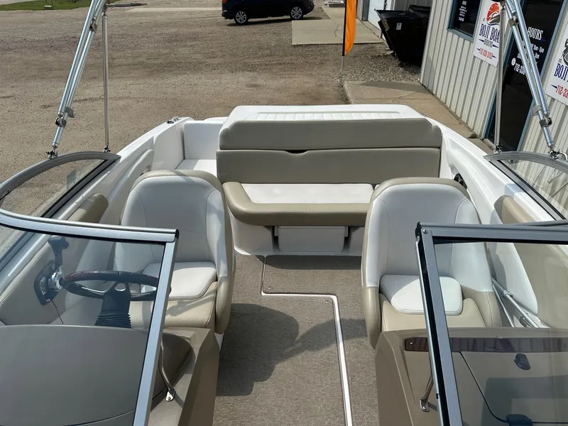 Slide: The Image of Interior of a 2015 Regal 1900 boat with seating and steering wheel. - 18