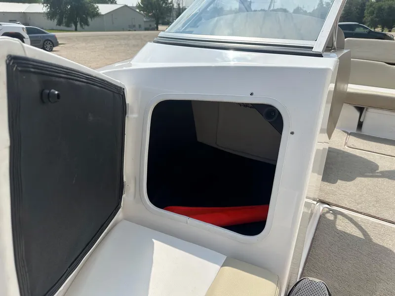 Slide: The Image of Open storage compartment on a 2015 Regal 1900 boat. - 19