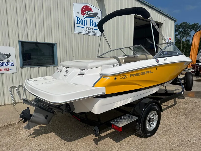 Slide: The Image of 2015 Regal 1900 boat in yellow and white, displayed at Boji Boat Brokers. - 2