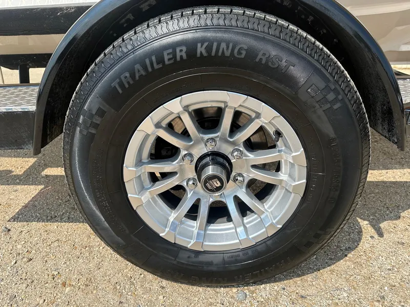 Slide: The Image of Close-up of a 2015 Regal 1900 trailer wheel with Trailer King RST tire. - 23
