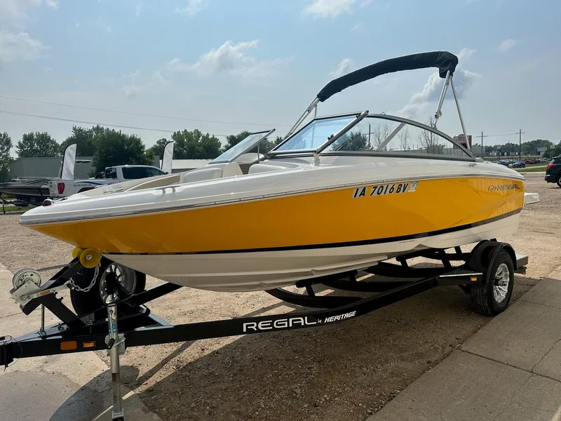 Slide: The Image of 2015 Regal 1900 boat with yellow hull on a trailer. - 5