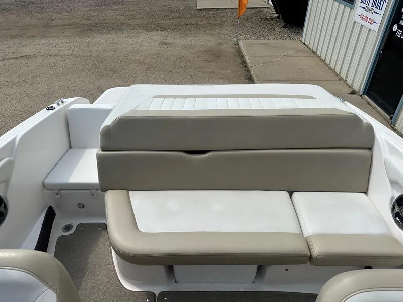 Slide: The Image of 2015 Regal 1900 boat interior with beige and white seating. - 8