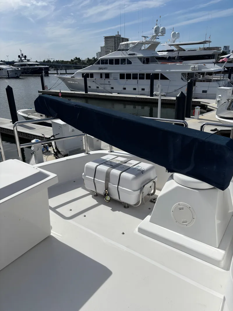 Slide: The Image of Luxury yacht docked at marina, featuring Horizon Vision 74, 2009 model. - 12