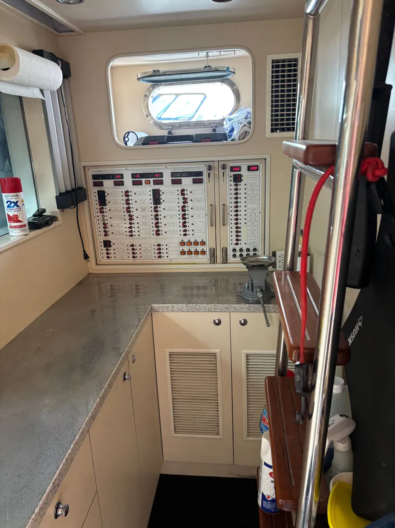 Slide: The Image of Electrical control panel in a 2009 Horizon Vision 74 yacht interior. - 20