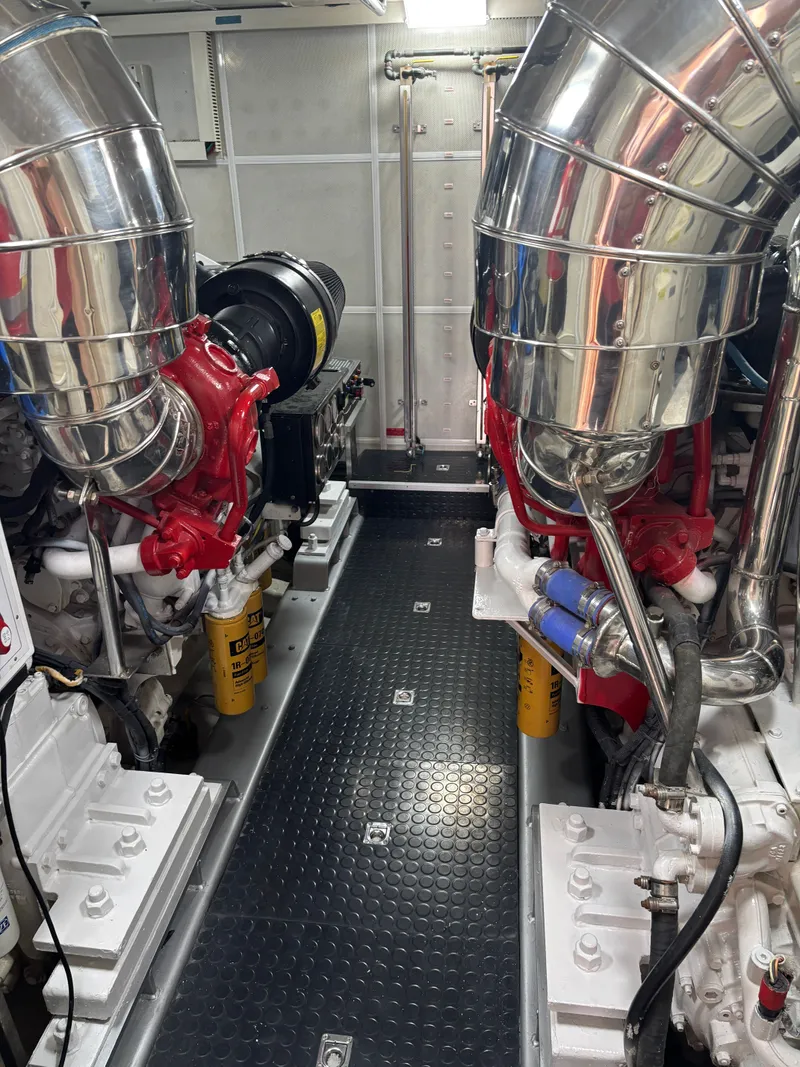 Slide: The Image of Engine room of 2009 Horizon Vision 74 yacht with polished metal components. - 21