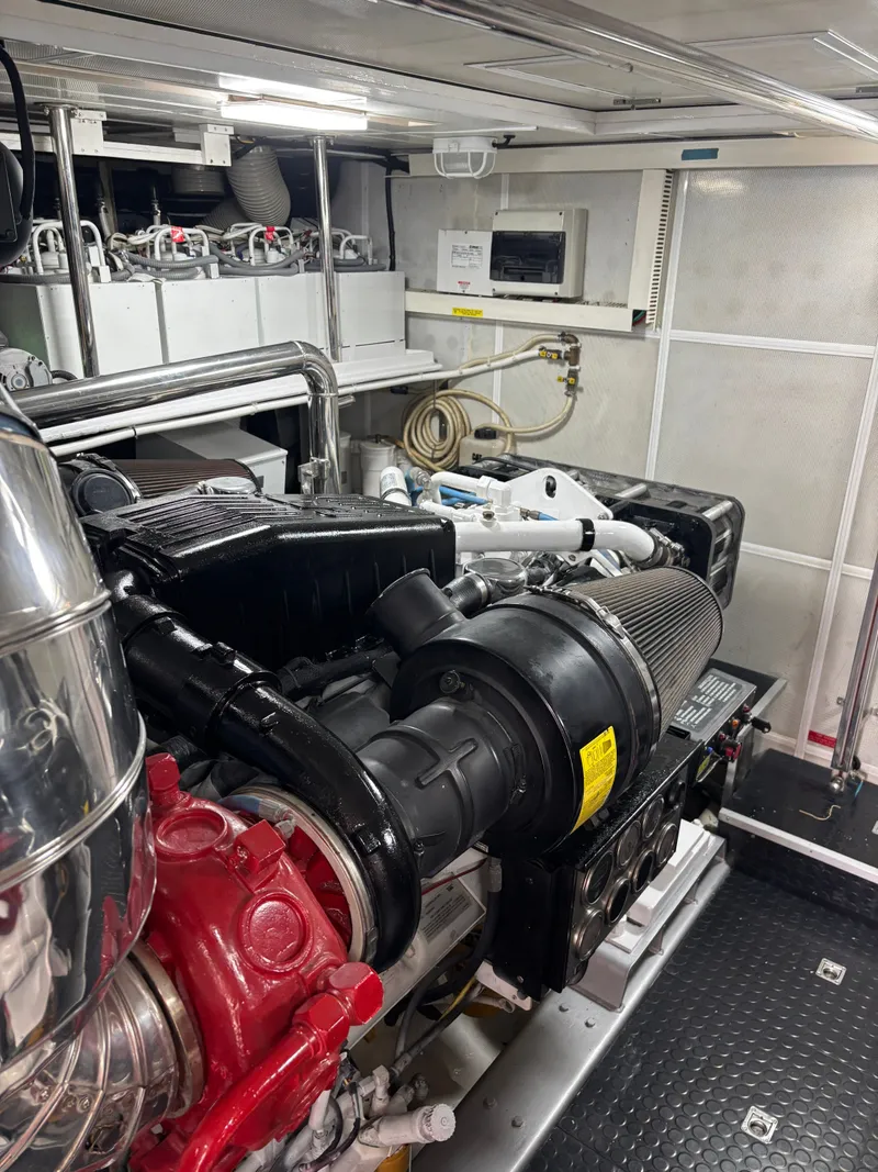 Slide: The Image of Engine room of 2009 Horizon Vision 74 yacht, showcasing machinery and equipment. - 24