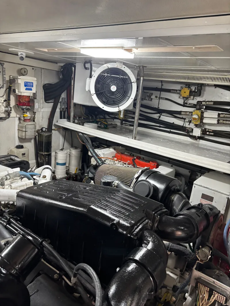 Slide: The Image of Engine room of 2009 Horizon Vision 74 yacht, featuring machinery and ventilation system. - 26