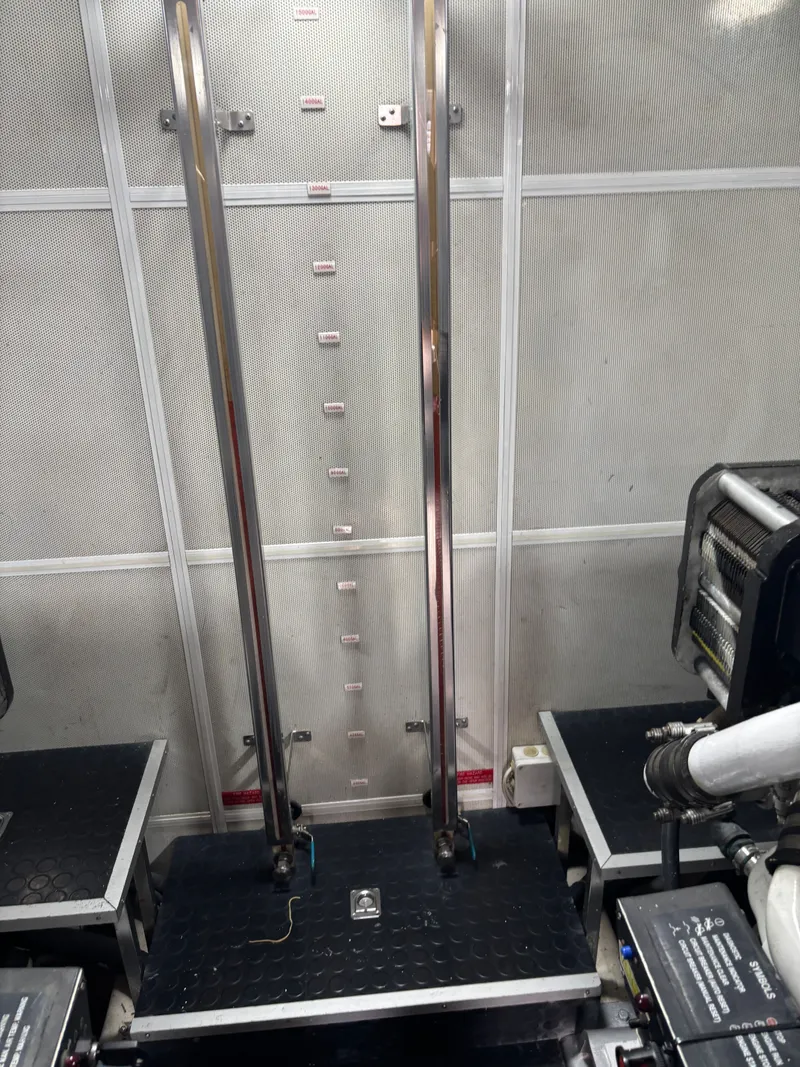 Slide: The Image of Engine room of 2009 Horizon Vision 74 yacht with metal pipes and machinery. - 27