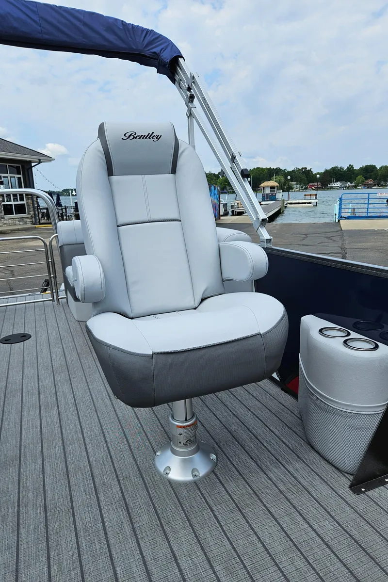 Slide: The Image of 2024 Bentley Pontoons Elite 220 Admiral captain's chair on deck. - 18