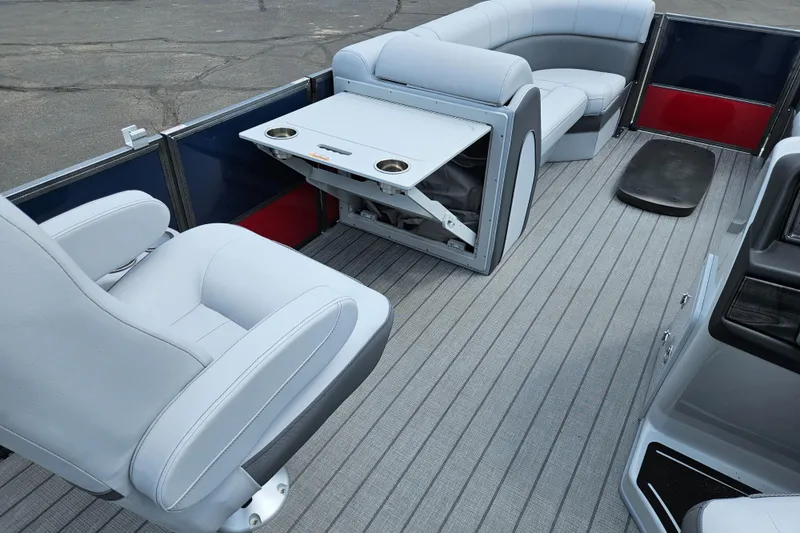 Slide: The Image of 2024 Bentley Pontoons Elite 220 Admiral interior with luxurious seating and foldable table. - 20