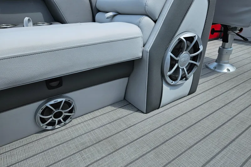 Slide: The Image of 2024 Bentley Pontoons Elite 220 Admiral interior with premium seating and built-in speakers. - 23