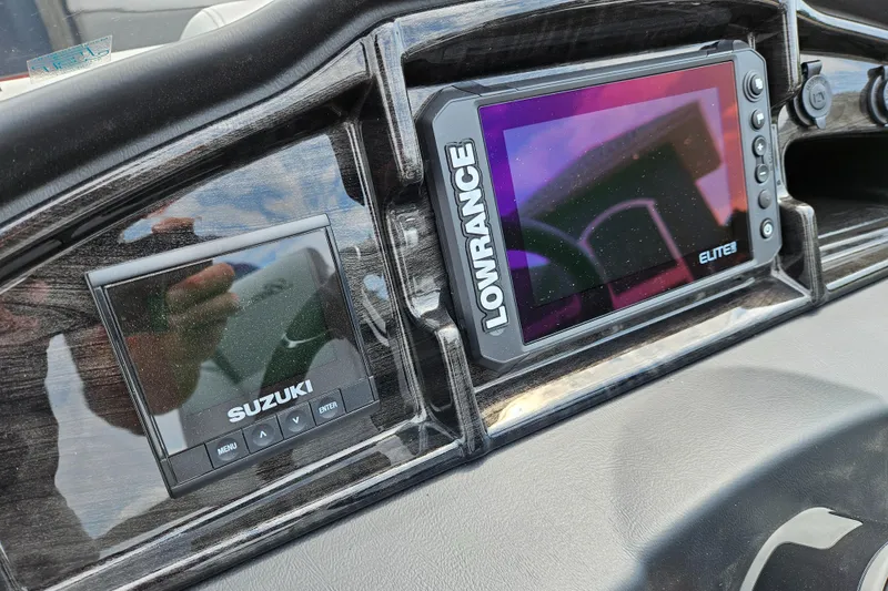 Slide: The Image of Dashboard of 2024 Bentley Pontoons Elite 220 Admiral with Lowrance and Suzuki displays. - 25