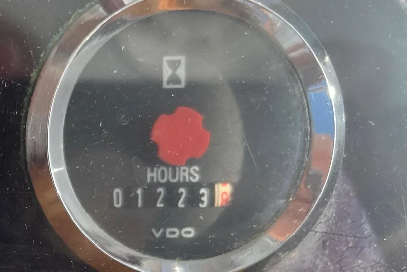 Slide: The Image of Hour meter on a 1985 Rybovich Walkaround boat showing 1223 hours. - 14