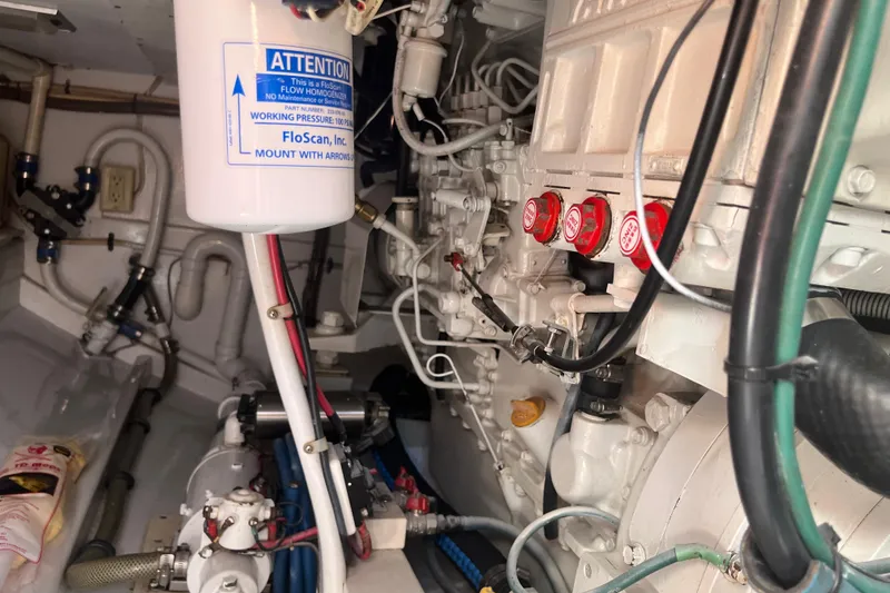 Slide: The Image of 1985 Rybovich Walkaround engine room with detailed mechanical components. - 18