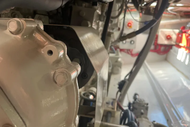 Slide: The Image of 1985 Rybovich Walkaround engine compartment with visible mechanical components. - 19