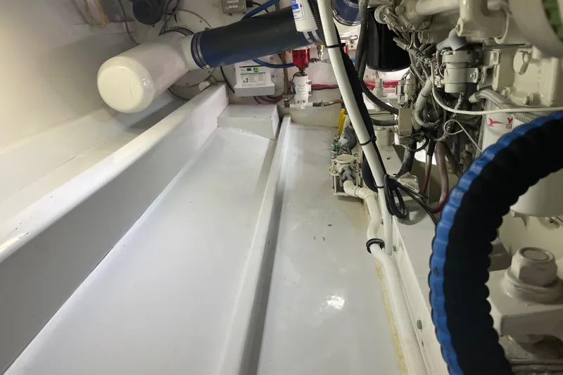 Slide: The Image of 1985 Rybovich Walkaround engine compartment with clean, organized components. - 20