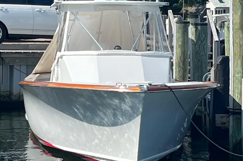 Slide: The Image of 1985 Rybovich Walkaround boat docked at a marina. - 7
