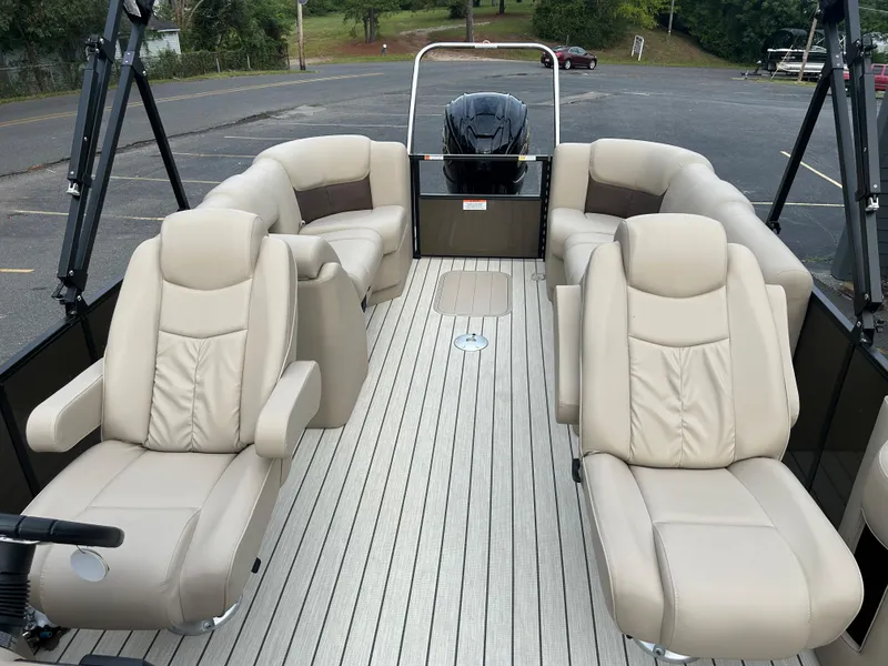 Slide: The Image of 2023 SunCatcher Fusion 324RC pontoon boat with beige leather seating and spacious deck. - 14