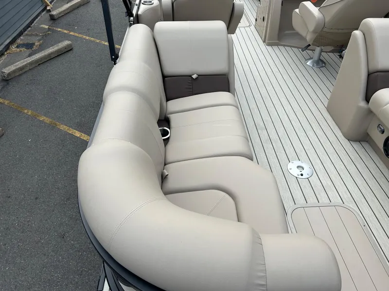 Slide: The Image of 2023 SunCatcher Fusion 324RC boat with beige seating and spacious deck. - 20