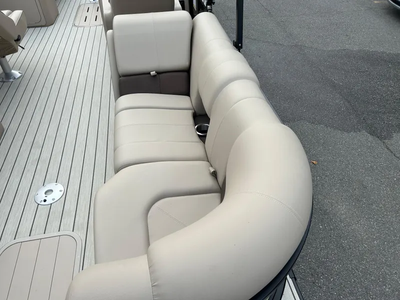 Slide: The Image of 2023 SunCatcher Fusion 324RC boat with beige cushioned seating. - 21