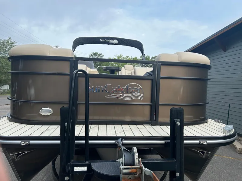 Slide: The Image of 2023 SunCatcher Fusion 324RC pontoon boat on trailer, rear view. - 3