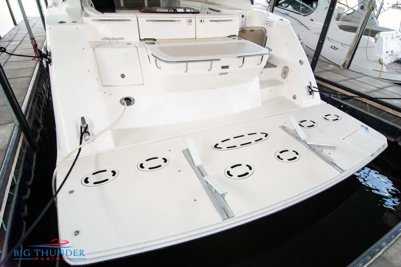 Slide: The Image of 2013 Sea Ray 540 Sundancer yacht stern view in marina. - 13