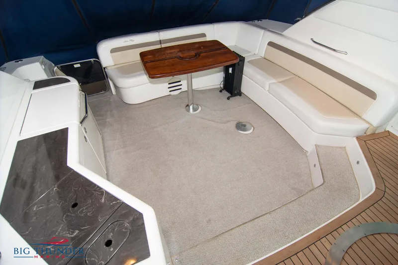 Slide: The Image of 2013 Sea Ray 540 Sundancer yacht interior seating area with table. - 24