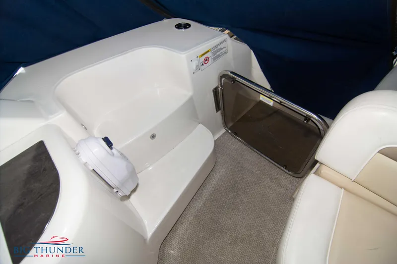 Slide: The Image of Interior seating area of 2013 Sea Ray 540 Sundancer yacht with white upholstery. - 25