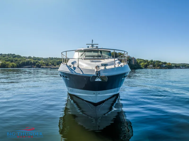 Slide: The Image of 2013 Sea Ray 540 Sundancer yacht on calm water, clear sky background. - 3