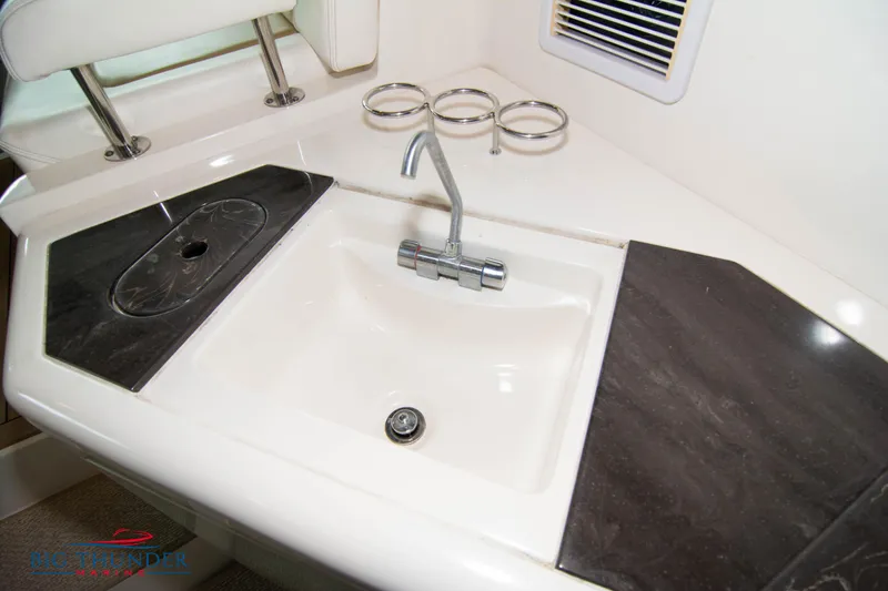 Slide: The Image of Sea Ray 540 Sundancer 2013 yacht sink with faucet and countertop. - 32