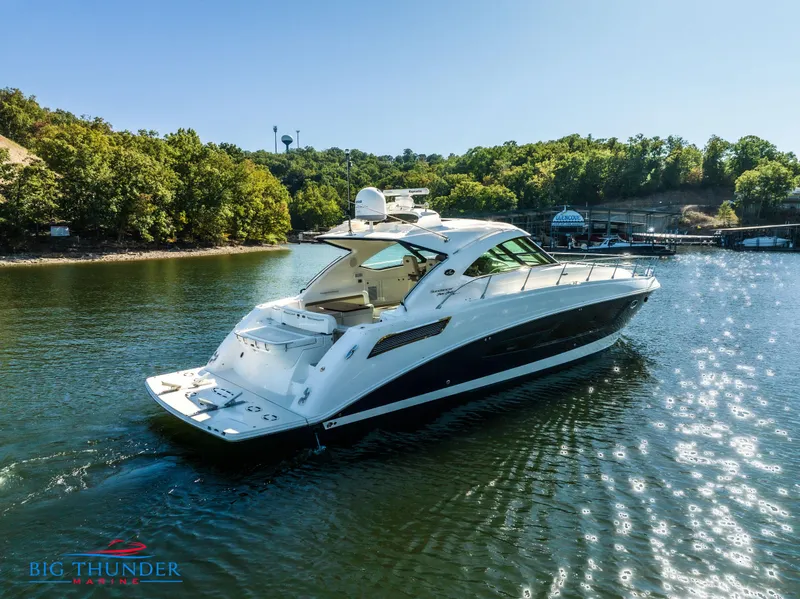 Slide: The Image of 2013 Sea Ray 540 Sundancer yacht cruising on a sunny lake. - 4