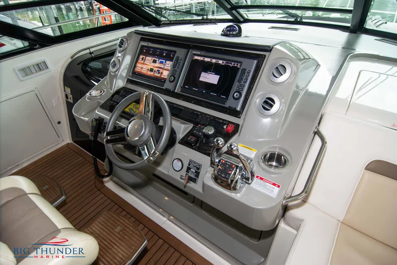 Slide: The Image of 2013 Sea Ray 540 Sundancer helm with advanced navigation system. - 46