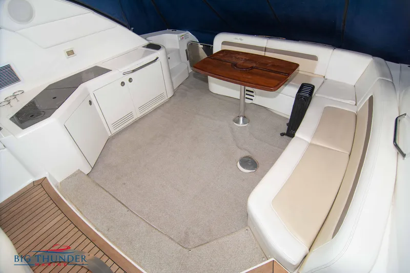 Slide: The Image of Interior seating area of a 2013 Sea Ray 540 Sundancer yacht with a wooden table. - 23