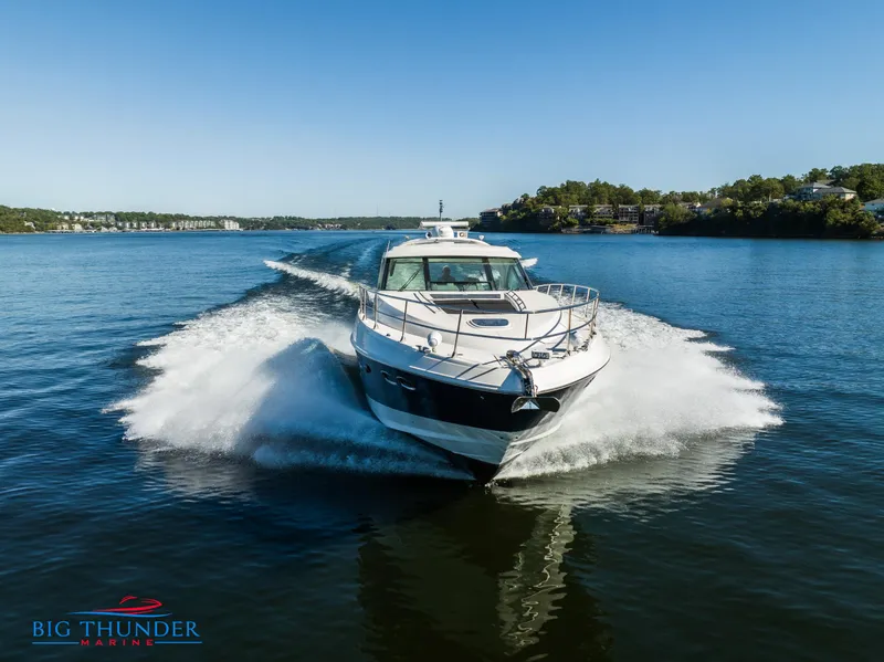 Slide: The Image of 2013 Sea Ray 540 Sundancer cruising on a serene lake. - 7