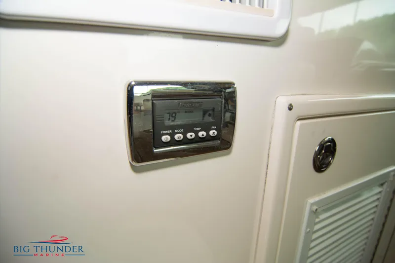 Slide: The Image of Control panel on 2013 Sea Ray 540 Sundancer yacht, Big Thunder Marine logo. - 39