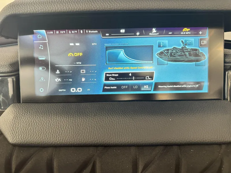 Slide: The Image of 2024 Nautique S23 touchscreen dashboard display showing boat controls and settings. - 15