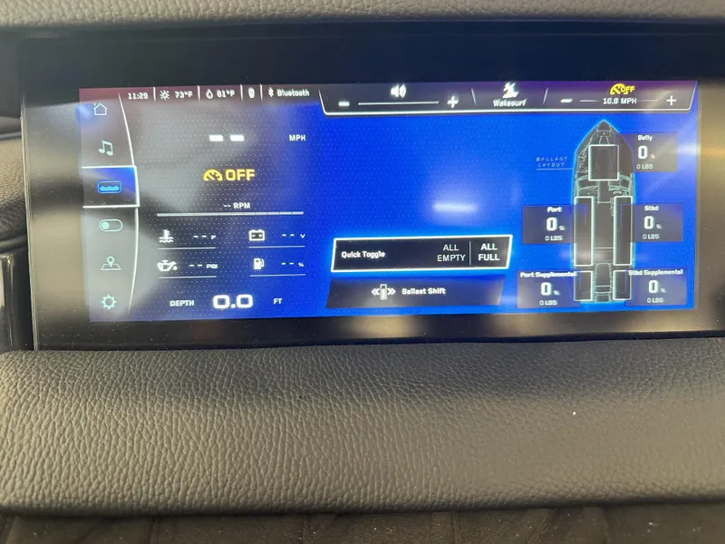 Slide: The Image of 2024 Nautique S23 dashboard display showing speed, RPM, depth, and ballast controls. - 16